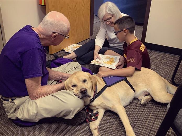  PIcture of volunteer with dogs